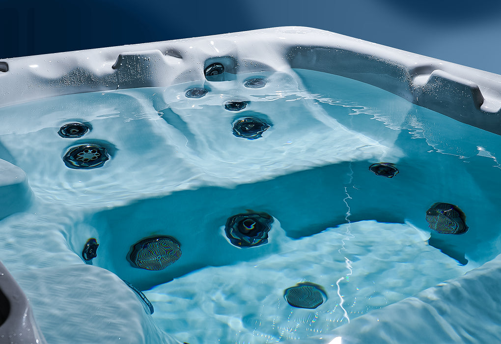 Clean spa jets inside a hot tub filled with clear water