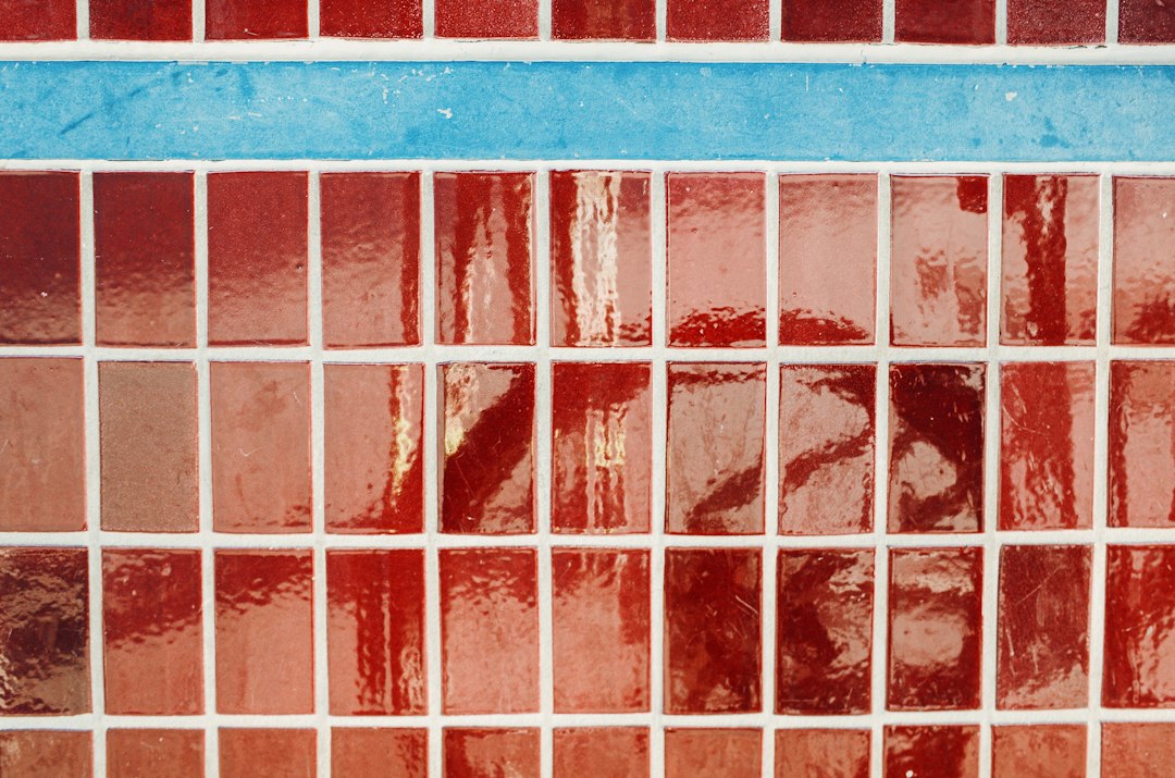 Red and blue mosaic tiles with white grout